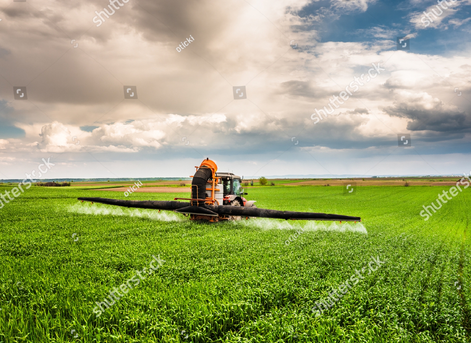 stock-photo-farmer-spraying-wheat-crops-field-1688612407_copy_1500x1093