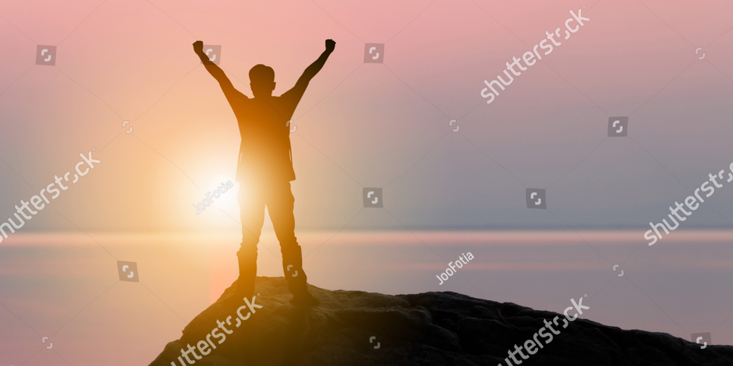 stock-photo-silhouette-of-man-standing-enjoying-on-a-stone-tropical-sunset-sunrise-evening-sky-at-beach-584383174_copy_1500x750